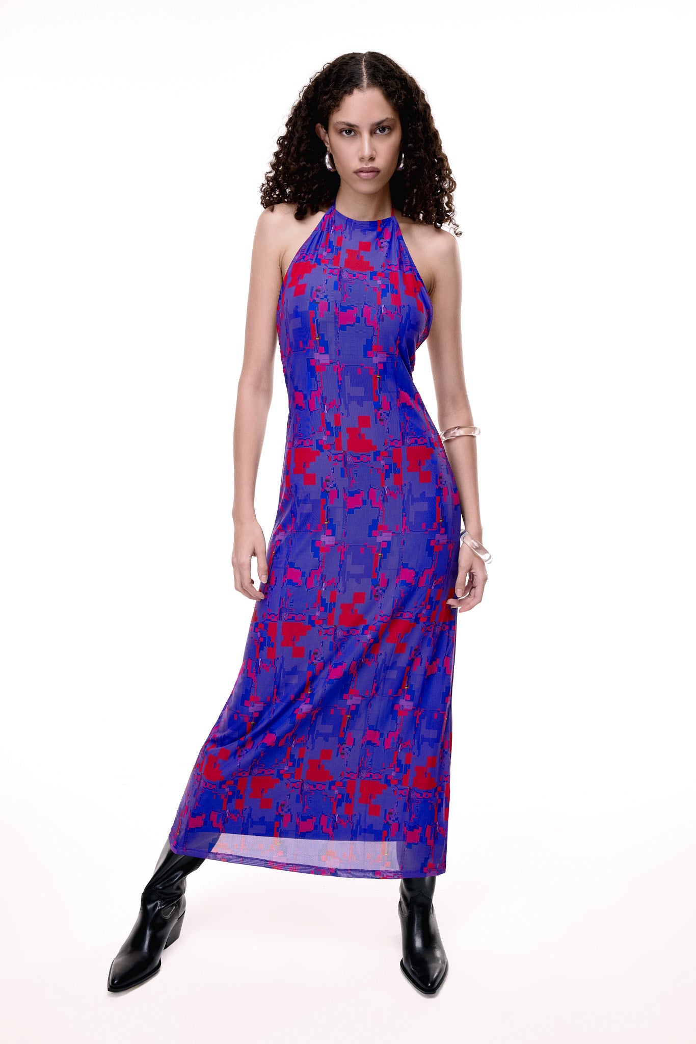 Woman wearing a purple and red patterned dress on a white background. Product is #404.BLUSH from GLIX.