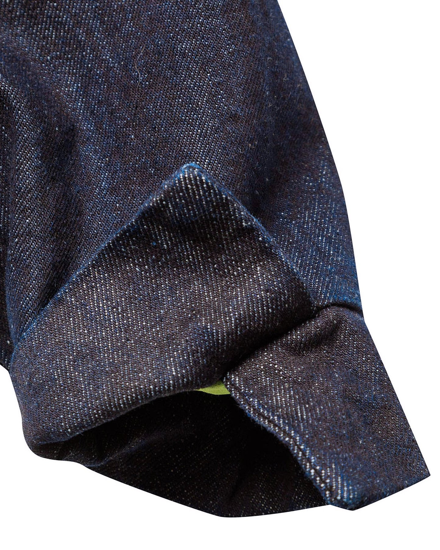 Macro close-up of the adjustable button cuff on the GLIX "Totem" denim crop bomber jacket, showing the dark wash denim texture, precise contrast stitching, and a glimpse of the neon green internal lining.