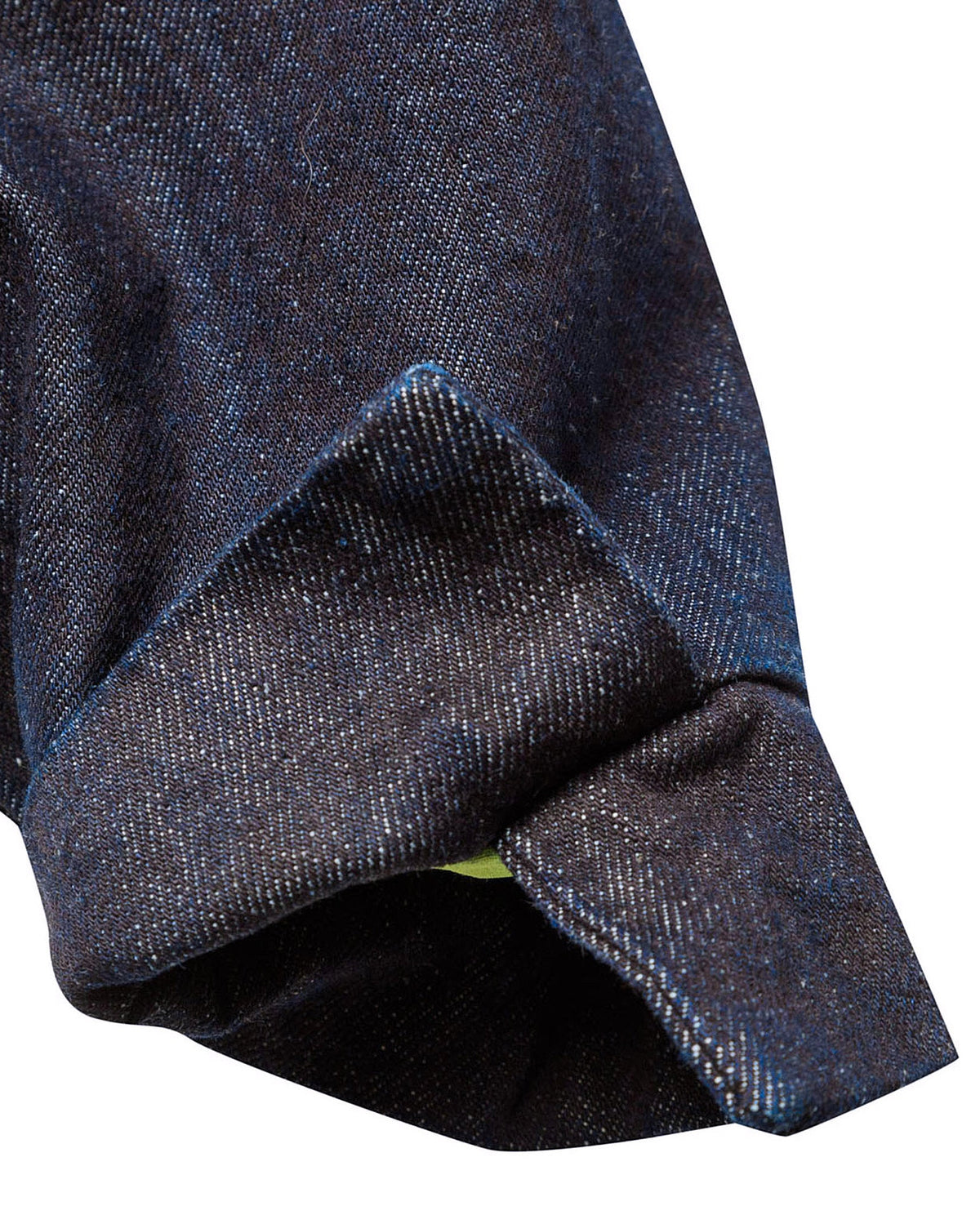 Macro close-up of the adjustable button cuff on the GLIX "Totem" denim crop bomber jacket, showing the dark wash denim texture, precise contrast stitching, and a glimpse of the neon green internal lining.