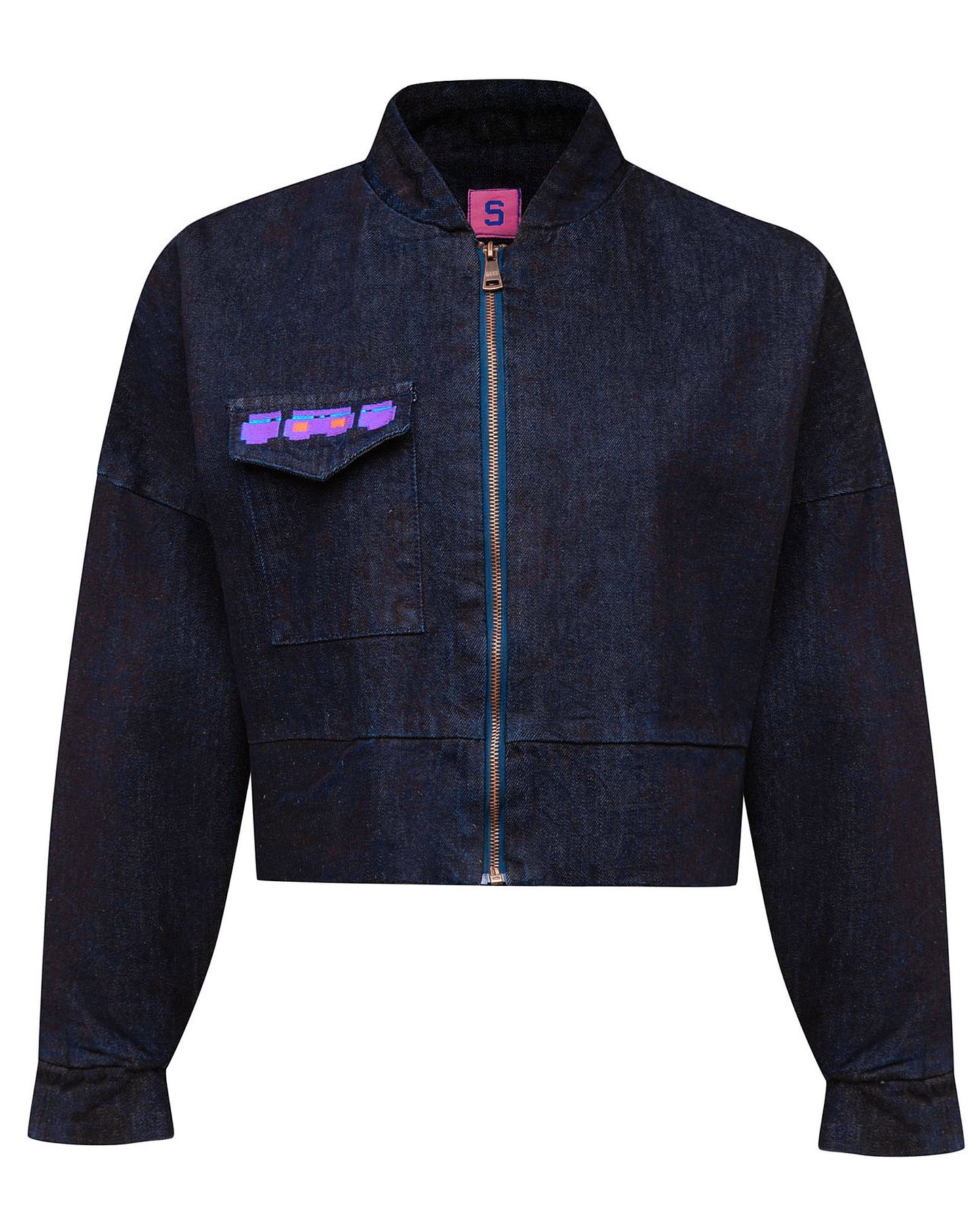 Front flat lay view of the GLIX "Totem" dark wash denim crop bomber jacket, featuring a zip-up front with blue tape detail, a single chest pocket with a purple and blue glitch logo, and a pink internal "S" size tag.