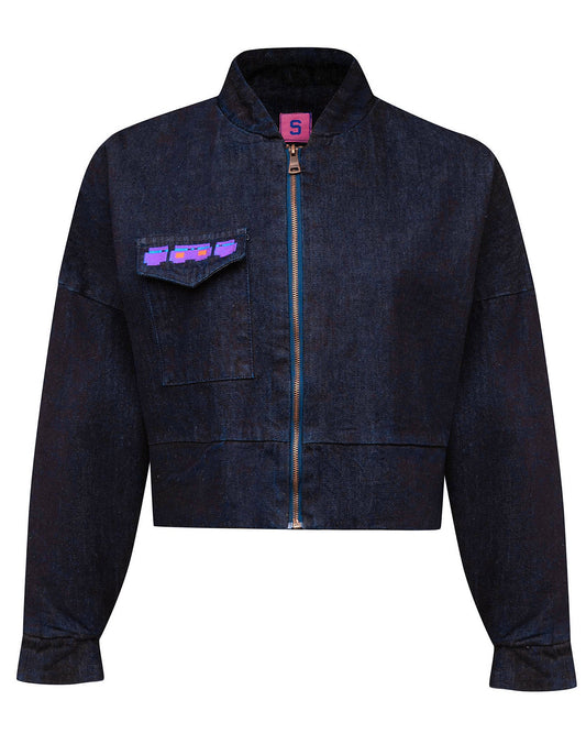 Front flat lay view of the GLIX "Totem" dark wash denim crop bomber jacket, featuring a zip-up front with blue tape detail, a single chest pocket with a purple and blue glitch logo, and a pink internal "S" size tag.