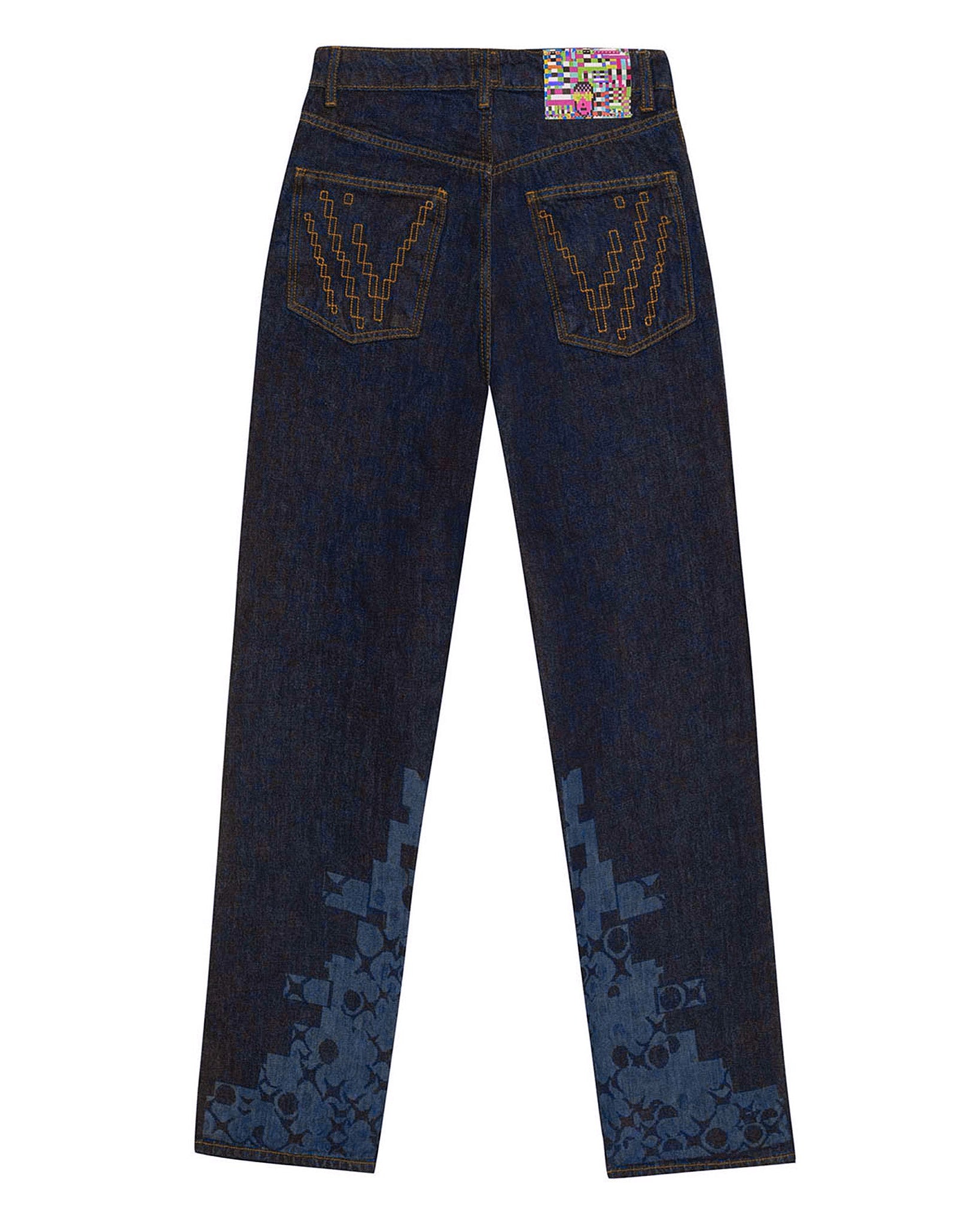 Flat lay back view of the GLIX "Cumulus" feminine fit jeans in dark wash denim, featuring tonal blue pixelated graphics on the lower legs, orange "V" stitch embroidery on the pockets, and a colorful digital glitch waist patch.