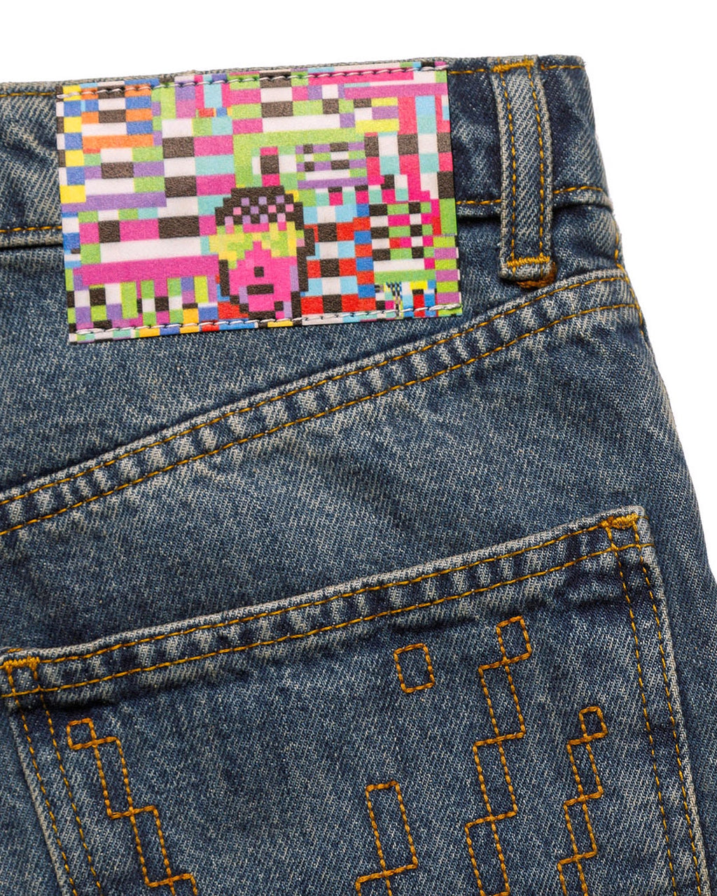 Macro close-up of the lower leg on the GLIX "Jetpack" feminine fit jeans, showing the intricate light blue pixelated glitch-style graphics printed on mid-wash denim.
