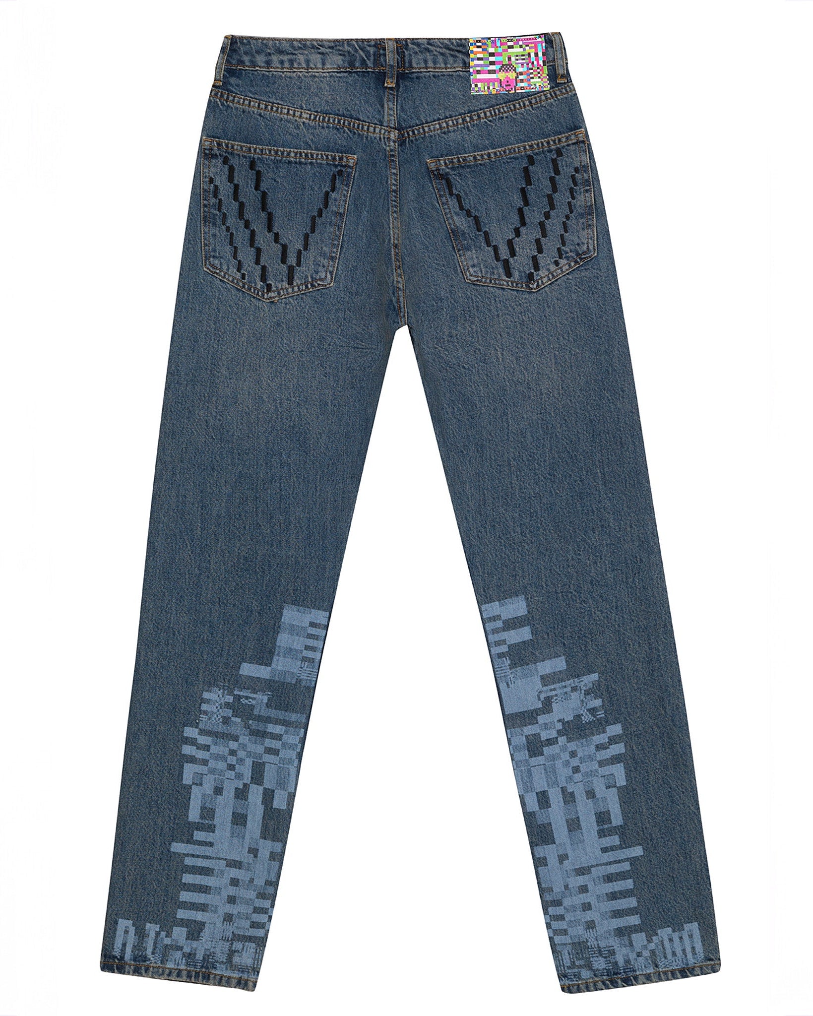 Flat lay back view of the GLIX "Jetpack" masculine fit jeans in mid-wash denim, featuring light blue pixelated glitch graphics on the lower legs, black "V" embroidery on the pockets, and a colorful digital glitch waist patch.