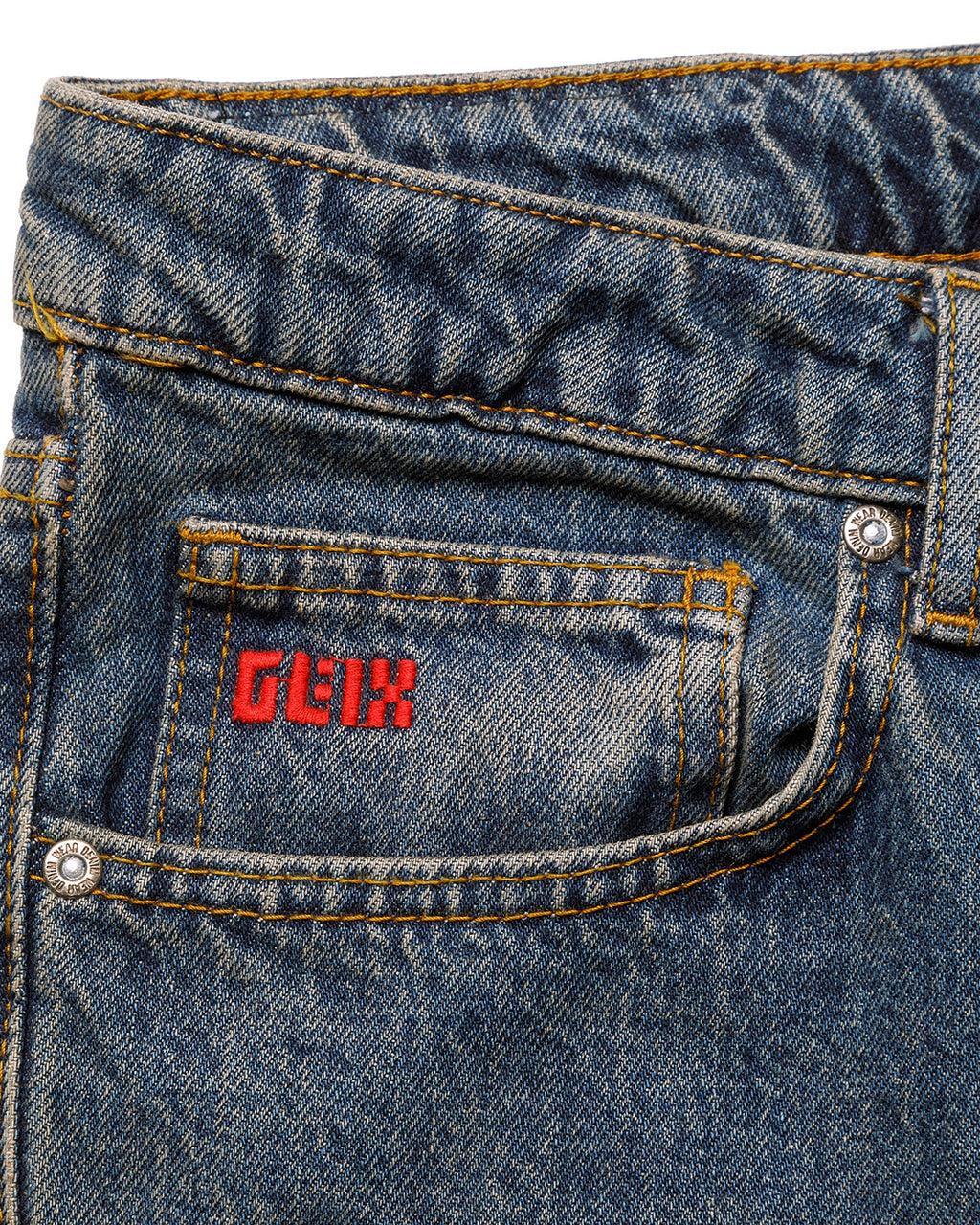 Close-up of a blue denim pocket with 'GLIX' branding on a white background

