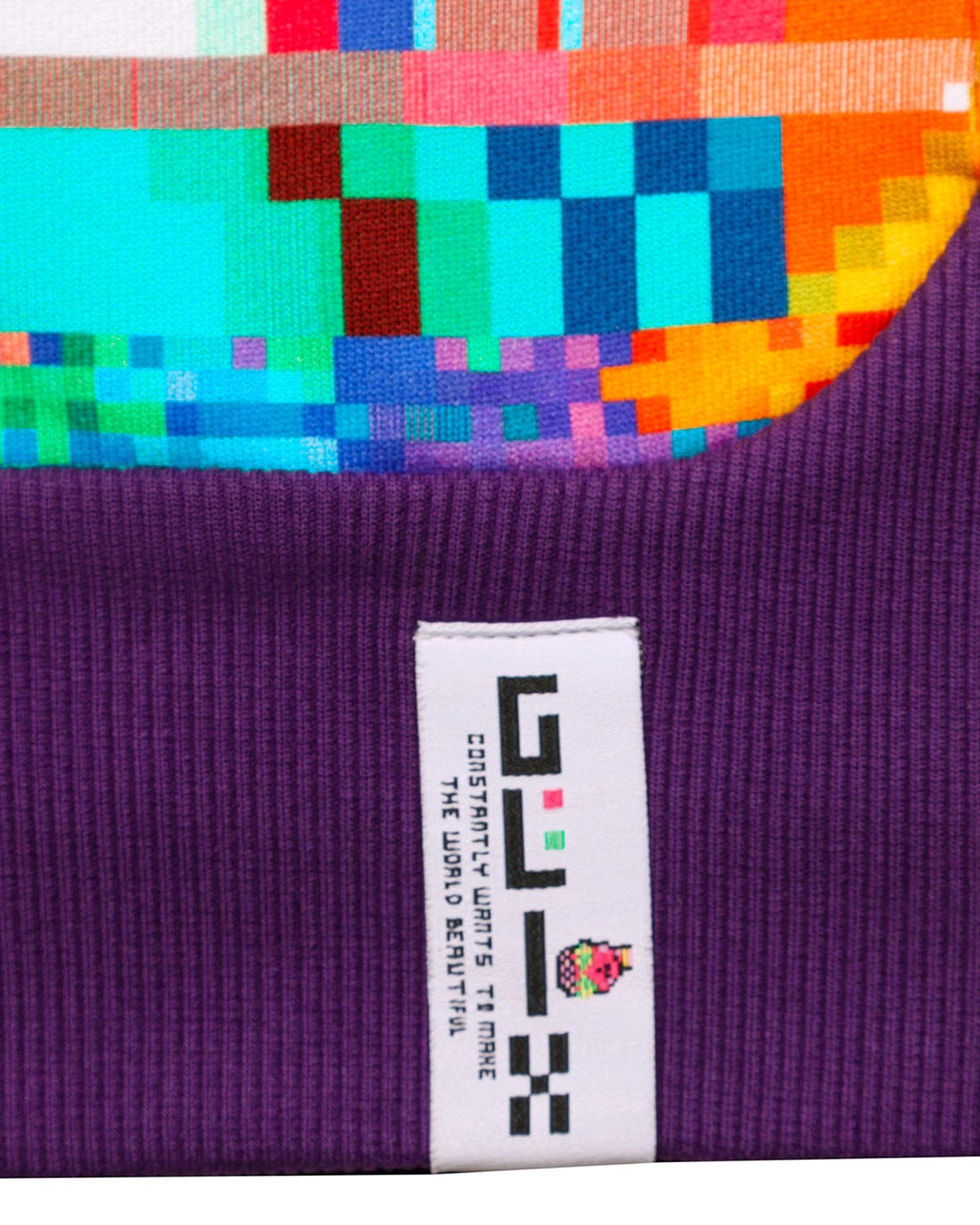 Close-up of a colorful fabric with a GLIX label on a purple background
