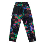 Flat lay back view of the GLIX "Screen Error" oversized sweatpants, featuring a dark, glitch-inspired all-over print with vibrant neon green, pink, and blue pixelated patterns and functional utility pockets.