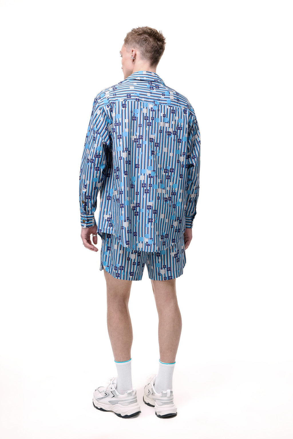 Back view of the GLIX WATER CRACKLE button-down shirt and matching shorts, showcasing the full-coverage generative digital print.