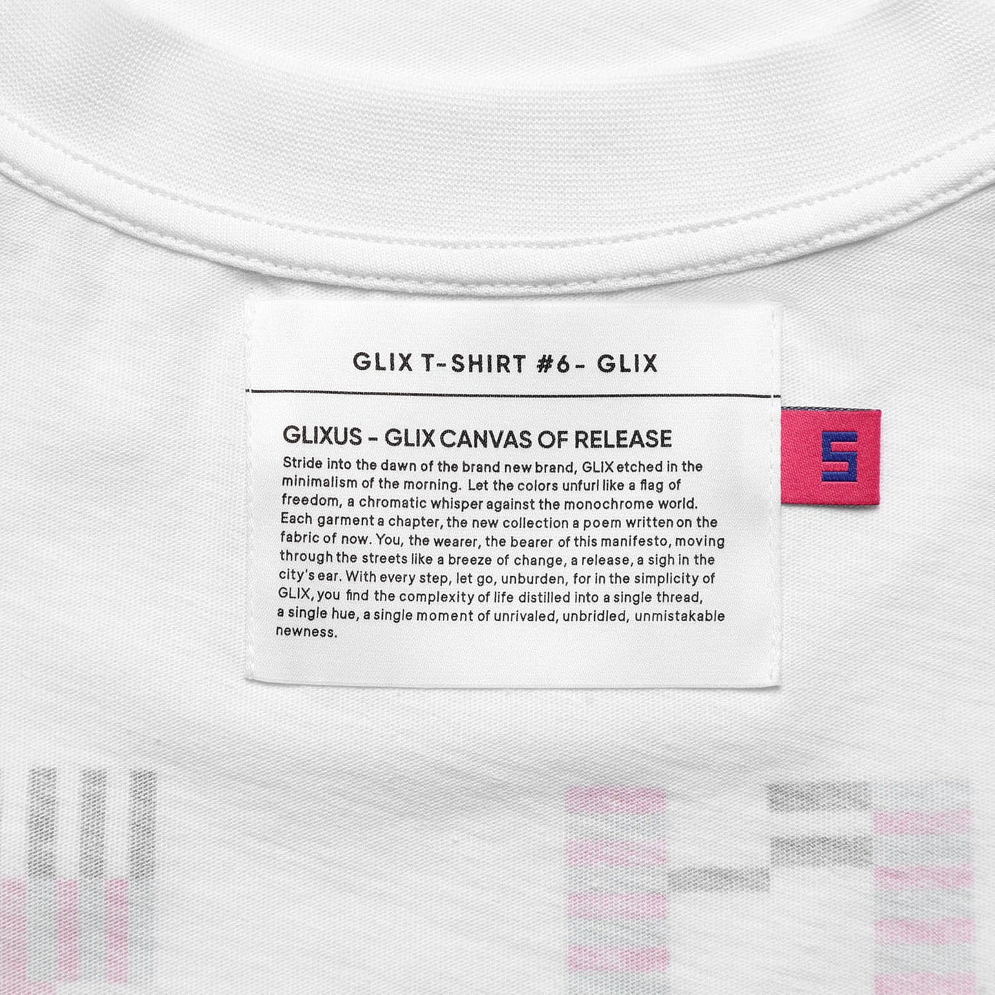 Close-up of the inner neck label on the GLIX T-SHIRT #6, featuring the "GLIXUS - GLIX CANVAS OF RELEASE" manifesto printed on a white fabric tag.